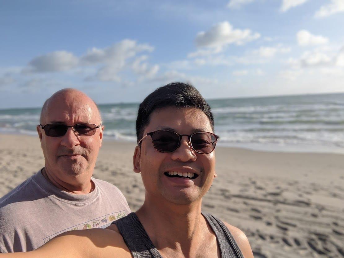 coming out asian couple beach